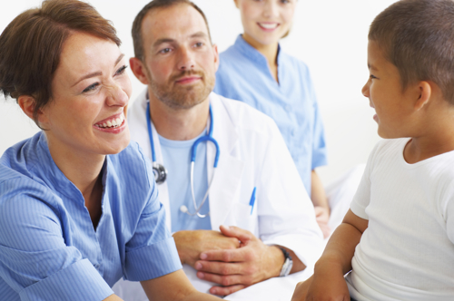 Doctors and nurses with a child